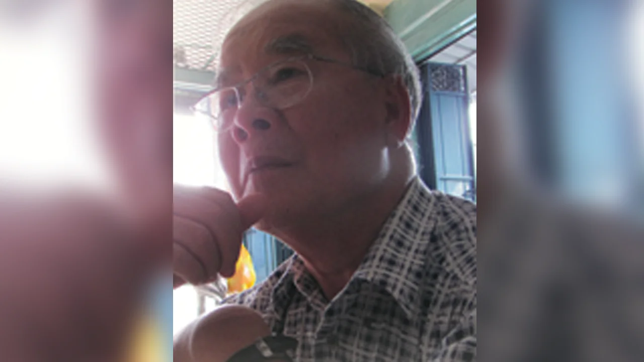 Mr. Goh Deo Chek, a 75-year-old colon cancer survivor, smiles warmly, embodying resilience and hope after his battle with cancer.